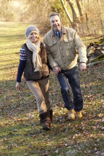 Woman and man walking on trail in cold weather