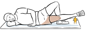Man lying on side doing inside straight leg raises.