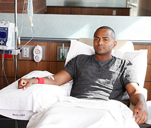 Man in outpatient clinic having chemotherapy infusion.